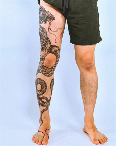 snake wrapped around leg tattoo|85 Snake Tattoos That May Have You Wrapping。